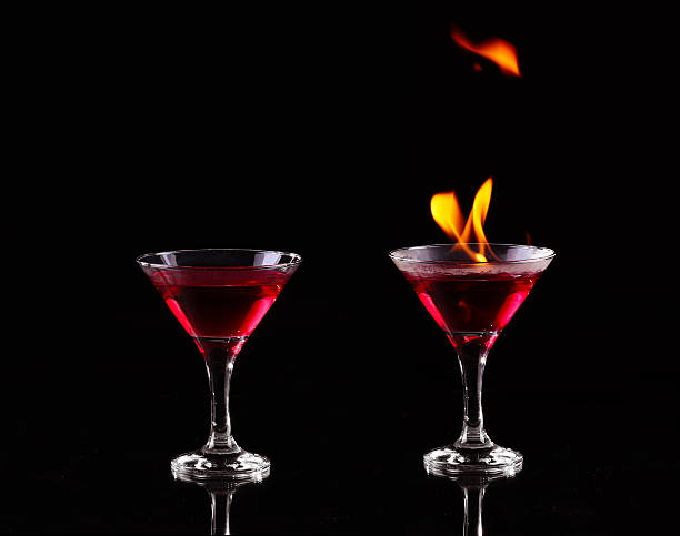 collage flaming cocktail auf schwarz - martini brand vermouth stock-fotos und bilder