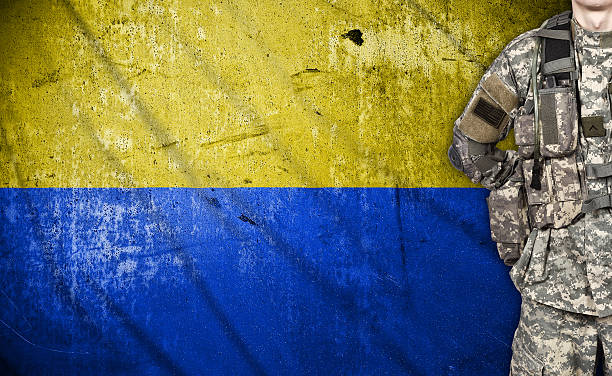 istock soldier with Ukraine flag 472346030