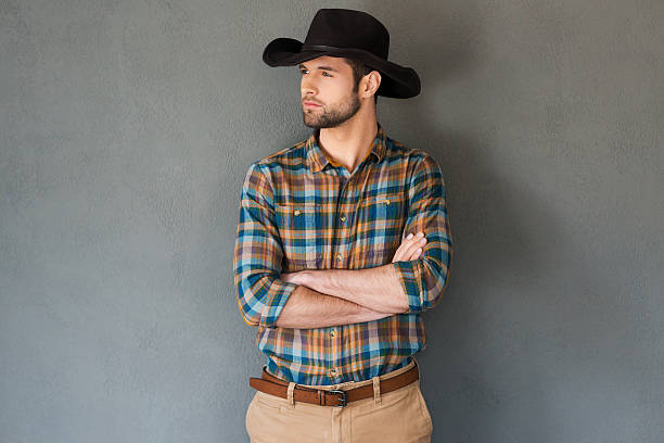 istock Serious and confident cowboy 472346226