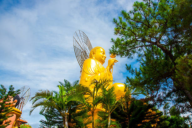 istock Religious monument, seated gold Buddha 472346420