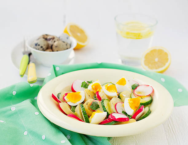 istock salad with cucumber, potatoes, radishes and eggs 472346926