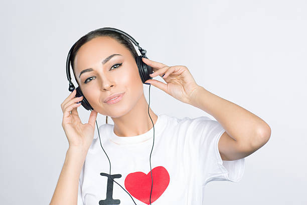 istock Woman wearing Headphones 472348754
