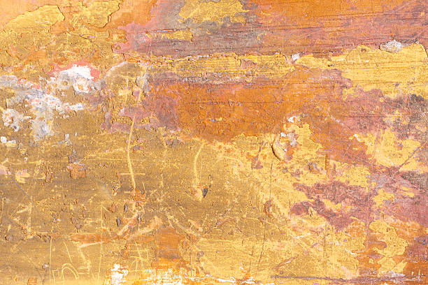 istock Yellow-Orange Mottled and Scratched Roman Wall Background Texture 472349070