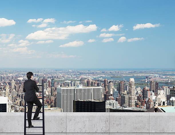istock businessman looking to city 472349784