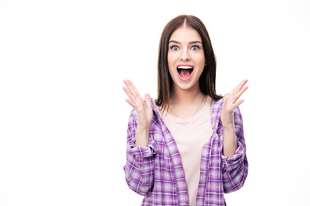 Surprised young female student over white background stock photo