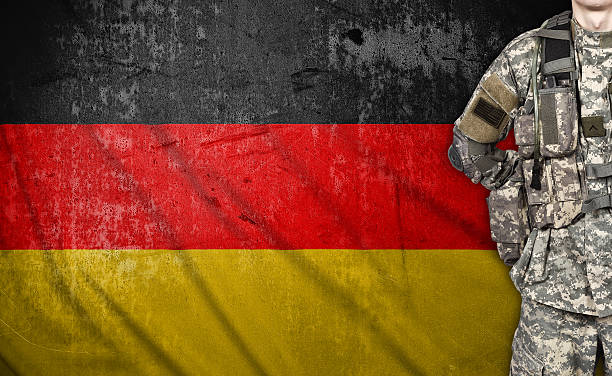 istock soldier and Germany flag 472350388