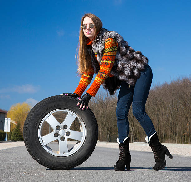 istock Leggy beautiful female holds big whee 472350506