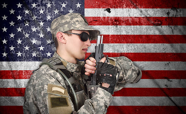 istock USA soldier with gun 472351074