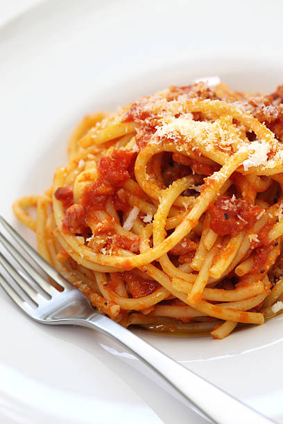 amatriciana, italian pasta cuisine bucatini alla amatriciana, italian tomato sauce pasta all'amatriciana stock pictures, royalty-free photos & images