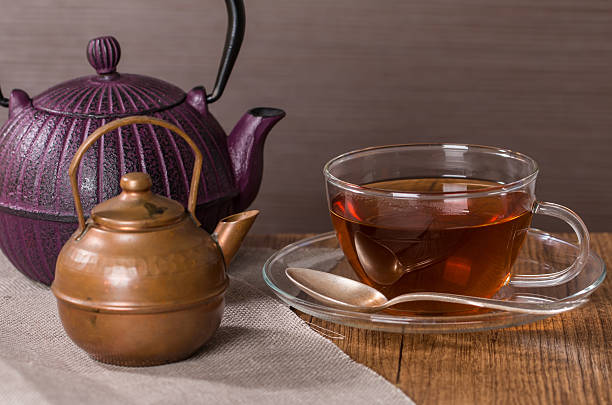 istock Cup of tea and a vintage teapot 472362894