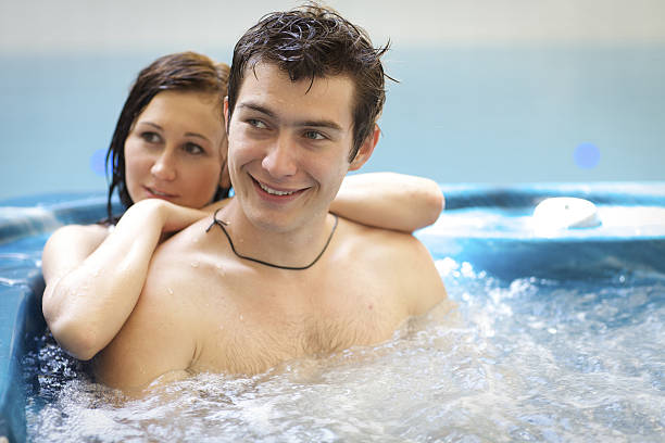 istock Couple bathing at hot tub 472363312