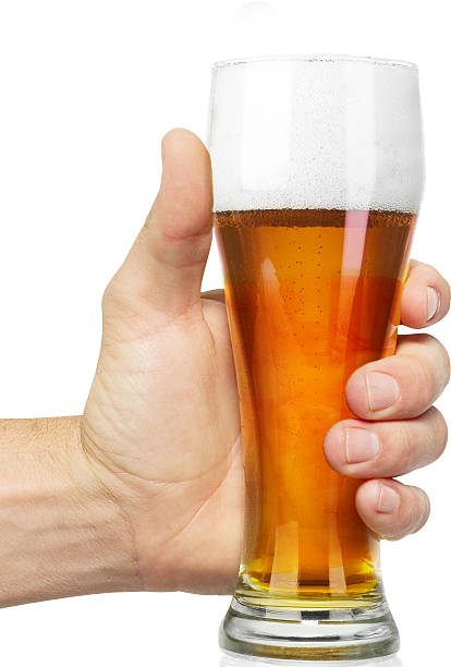 istock hand hold glass mug of beer 472368470
