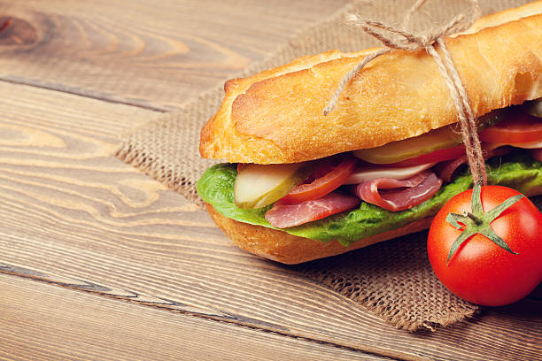 istock Sandwich with salad, ham, cheese and tomatoes 472376714