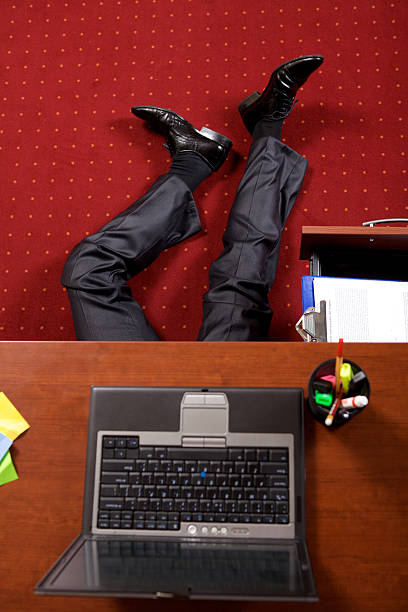 istock Businessman lying in the office 472377734