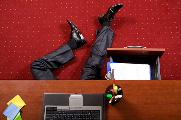 istock Businessman lying in the office 472377736