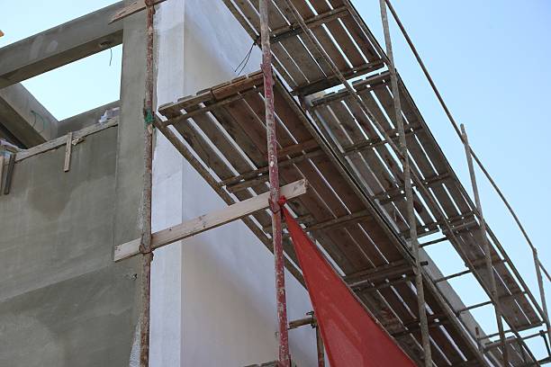 istock Construction building walls under painting with pipe staging. 472381880