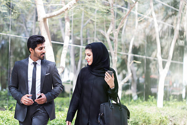 istock Business people meet outdoors in Dubai. 472385990
