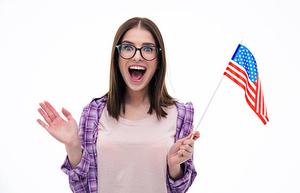 istock Surprised young woman with US flag 472386362