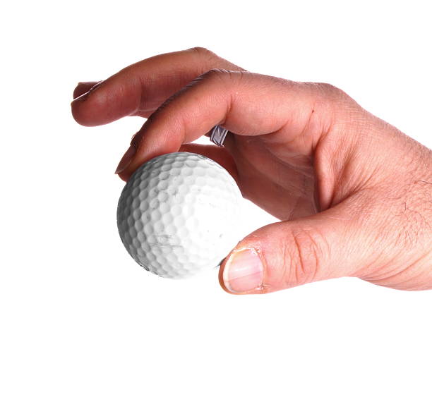 istock Studio shot of an hand holding a golf ball 472387574