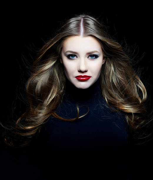istock glam woman with windy hair 472387776