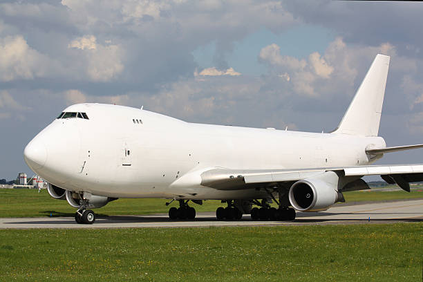 istock White cargo plane taxi for take off 472391914