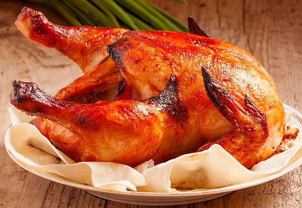 istock baked chicken on a plate with pita bread 472393416