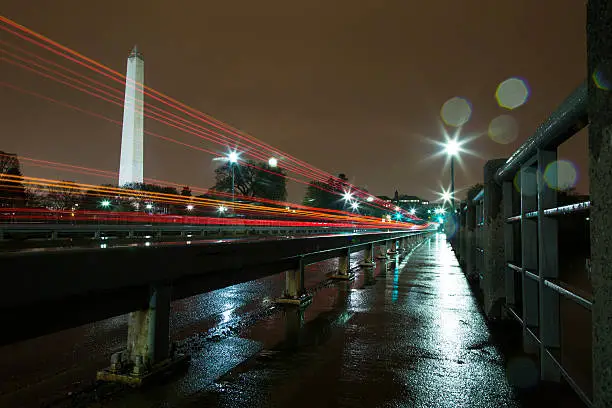 Photo of Washington Monument Lit Up at Night in the Rain