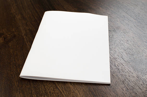 istock Blank brochure isolated on wood 472394976