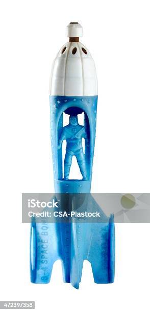 Blue Man Inside Blue And White Rocket Stock Photo - Download Image Now - Rocketship, Plastic, 2015