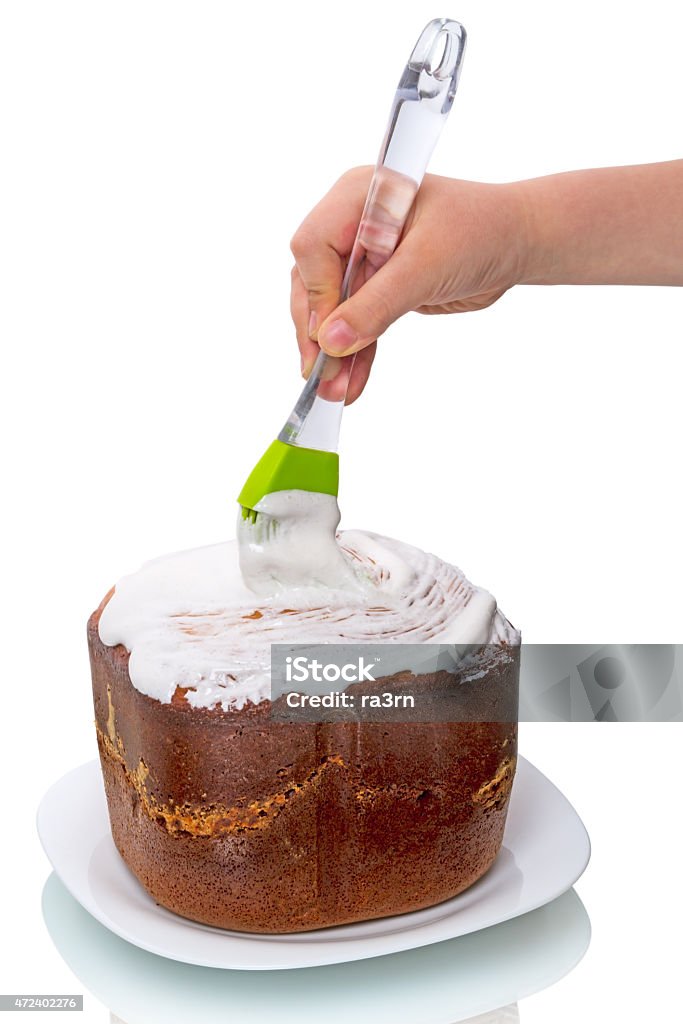 Child preparing cake Child preparing cake isolated on a white background 2015 Stock Photo