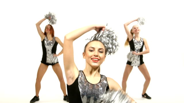 Girl in black costume  with pom-poms dancing on  white background. Close up