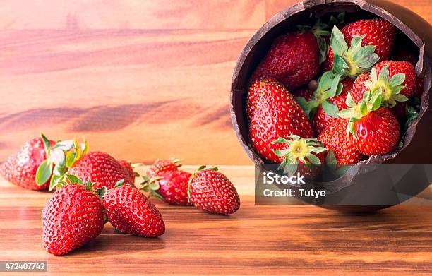 Chocolate Easter Egg Filled With Strawberries Stock Photo - Download Image Now - 2015, Broken, Brown