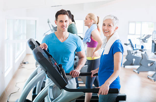 istock People running on treadmill at gym 472408428