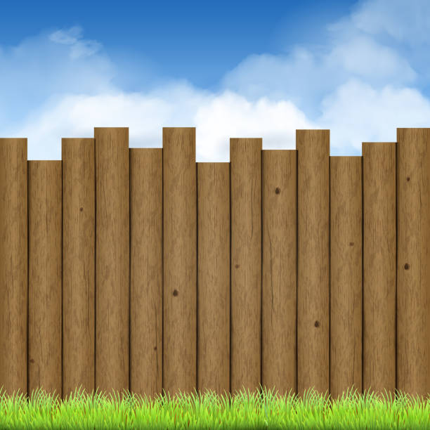 istock wooden fence with green grass and blue sky 472419278