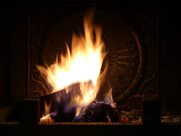 istock Burning firewood in the fireplace 472419612