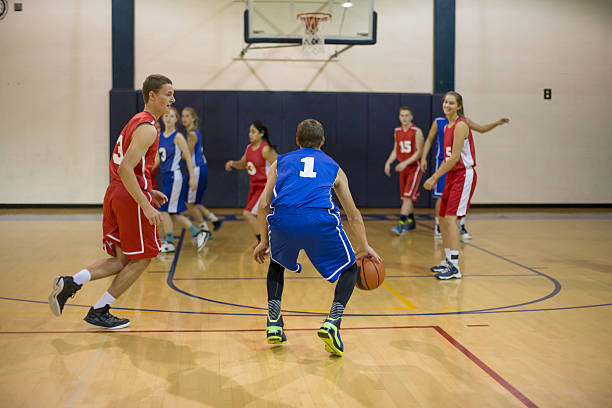 istock Co-ed High school basketball players 472464726