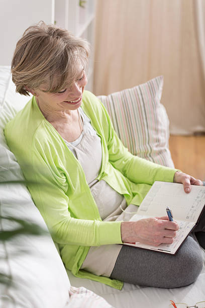 istock Woman writing in agenda 472465062