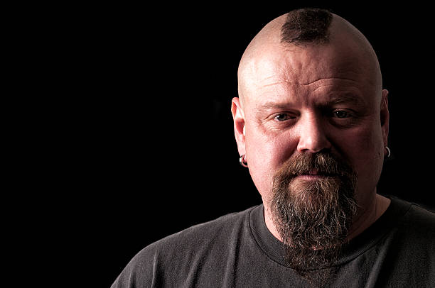 istock tough guy with mohawk hairstyle looking at camera 472465330