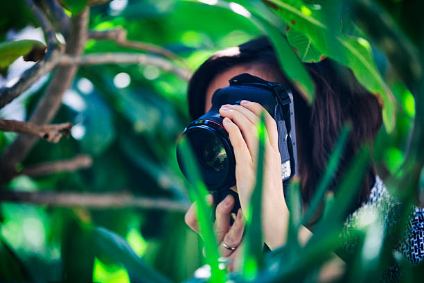 istock Photographer Photographing in Lush Foliage 472465392