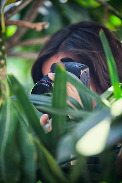 istock Photographer Photographing in Lush Foliage 472465396