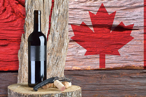 istock bottle of wine with Canada flag in the background 472468624