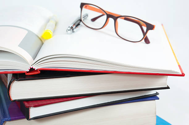 Books stack with open book and glasses Books stack with open book and glasses case study stock pictures, royalty-free photos & images