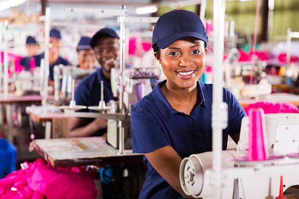 istock young african textile worker in factory 472471630