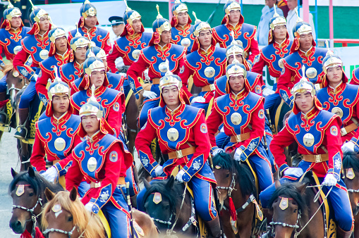 Ulaanbaatar, Mongolia - July 11, 2010: Riders at Nadaam Opening Ceremony in capital Ulaanbaatar. Nadaam or the Three Manly Games is the most important festival of the year in Mongolia from 11-13 July. Its roots lie in Mongolian warrior traditions. Competitions include horse racing, wrestling and archery.
