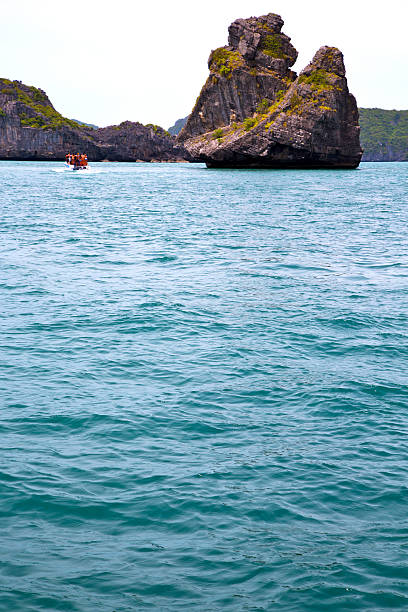 istock prayer monkey rock in thailand kho phangan  bay abstract boat 472474300