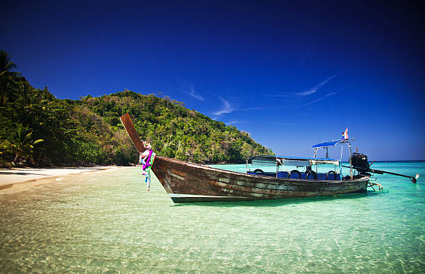 istock Longtail boats on the beautiful beach, Thailand 472474892