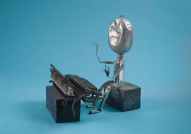 Recycled sculpture of a writer typing.