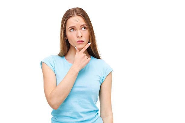 istock Beautiful thoughtful woman looking up - isolated on white. 472475232