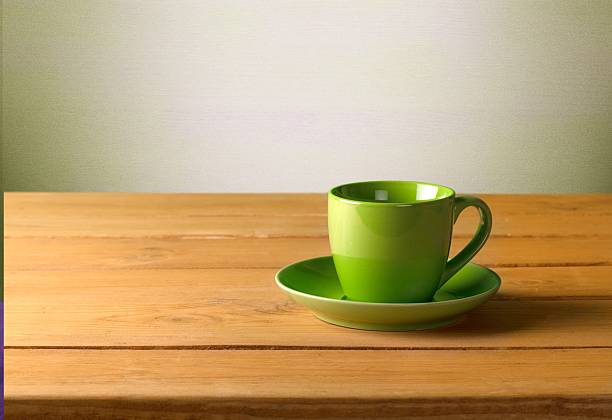 istock Arrangement. Red cup on wooden table over grunge background 472479170