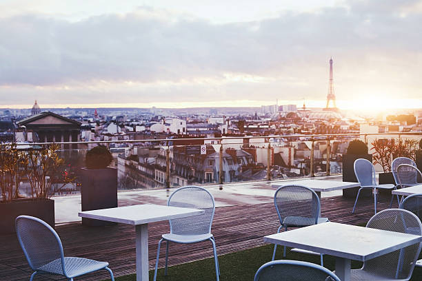 rooftop restaurant in Paris sunny terrace of restaurant in Paris with panoramic view on Eiffel tower, France restaurant france stock pictures, royalty-free photos & images